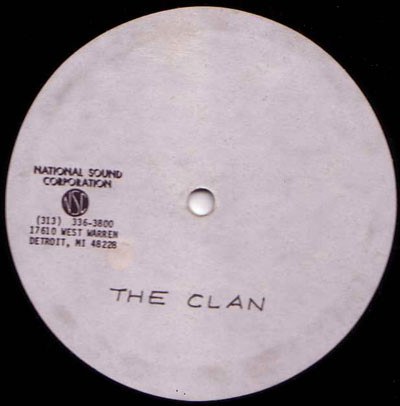 Blank white vinyl record label stamped "THE CLAN" with National Sound Corporation address in Detroit.