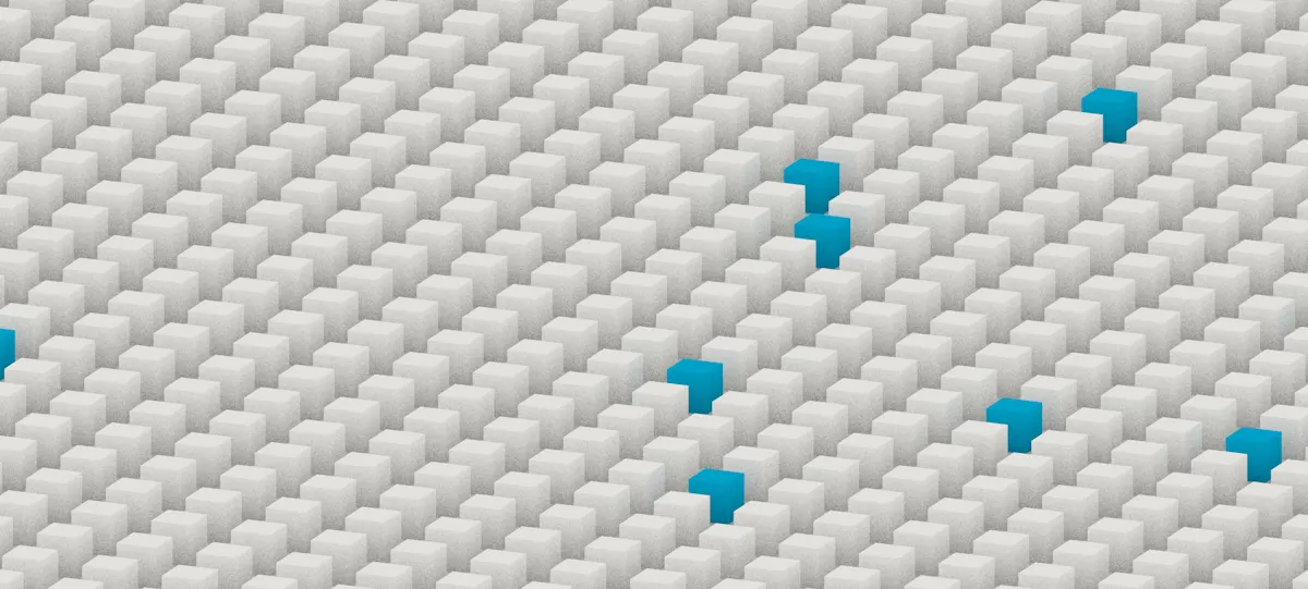 A dense diagonal grid of white 3D blocks with a scattered few rendered in bright blue.
