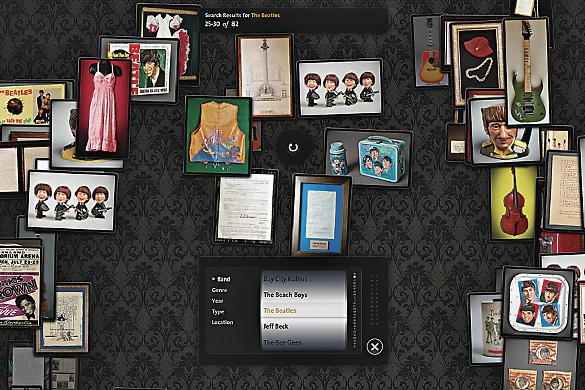 Touchscreen interface showing framed Beatles memorabilia on a dark damask wall with a band search filter panel.