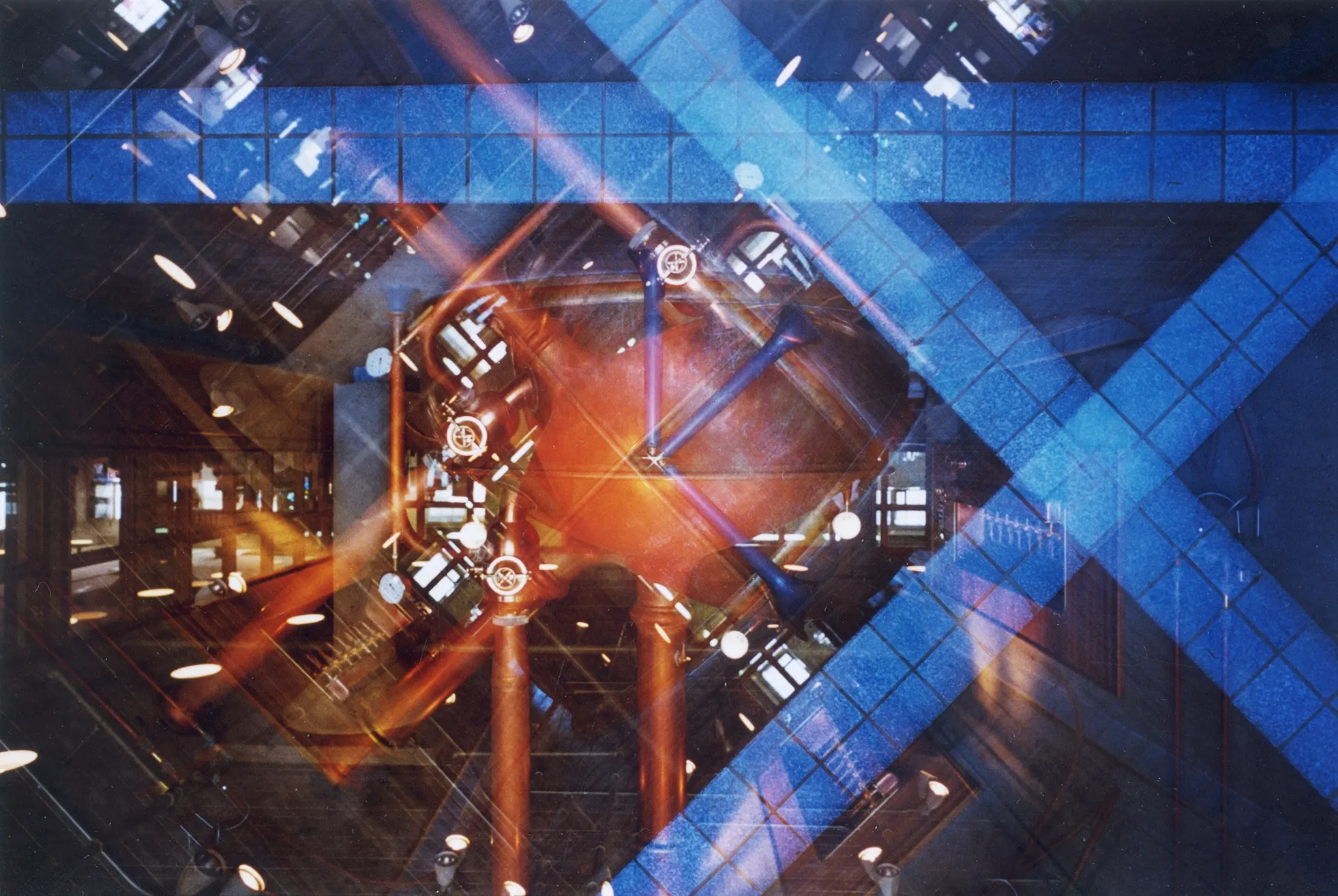 Multiple-exposure photograph of an interior with crossing blue diagonal grids over orange and warm-lit structural beams.