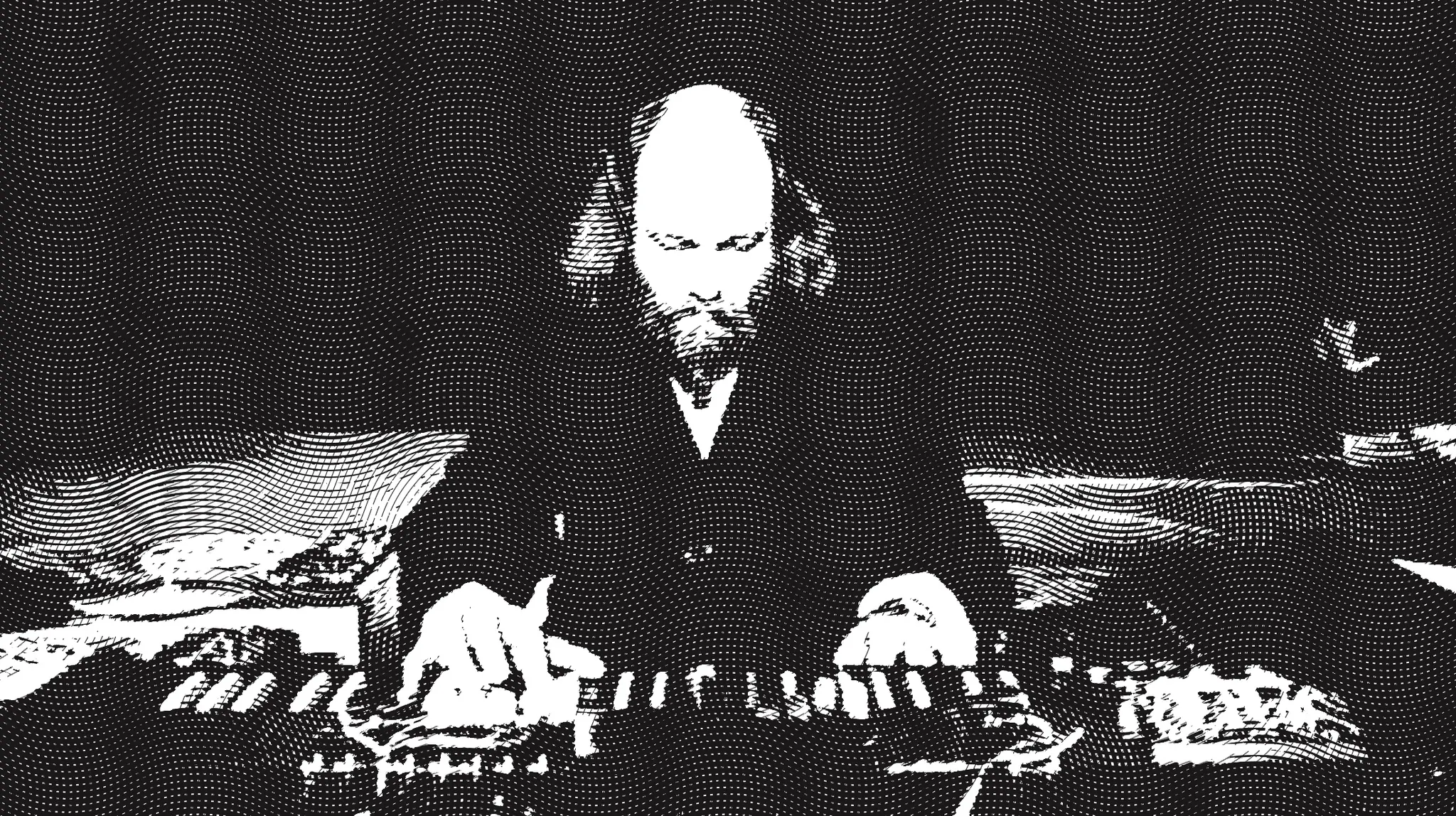 High-contrast halftone image of a bearded man seated behind keyboards and electronic equipment, hands on the keys.