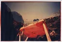 Red Carved Table on Rocky Coast